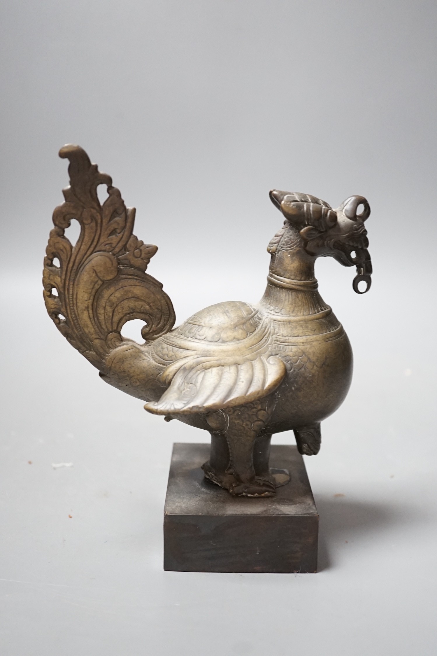 A 19th century Indian engraved bronze bird on plinth, 14.5cm wide